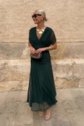 Long women's dress with wrapped pleated neckline, fluid fabric